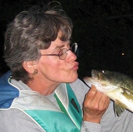 Photo of Becki Moffett-Mooer kissing a fish